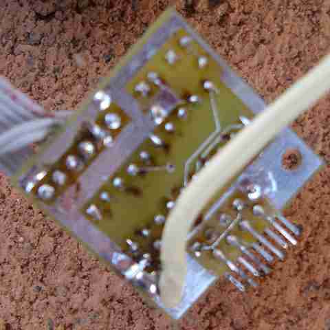 Bottom of PCB showing DB9F extended using wires